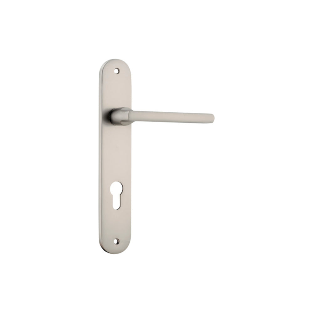 Pair of Iver Baltimore lever door handles on oval backplates, featuring a sleek, modern design in a polished finish.