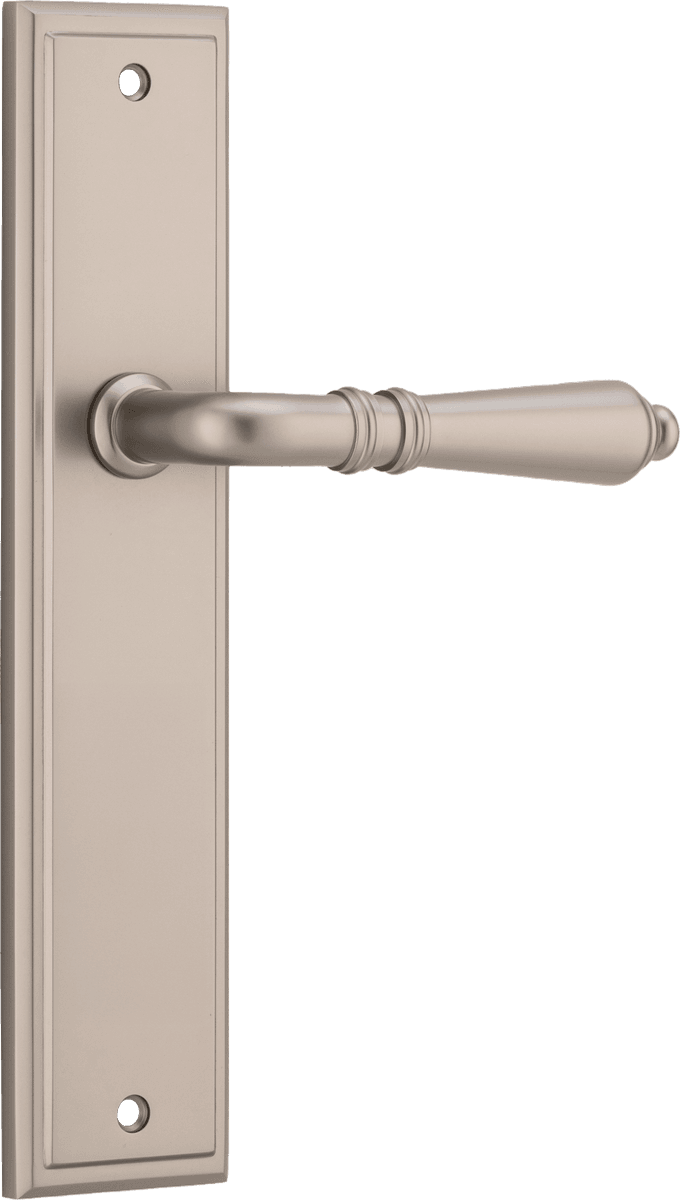 Pair of Iver Sarlat lever handles on stepped backplates, featuring classic brass finish and elegant design for interior doors.