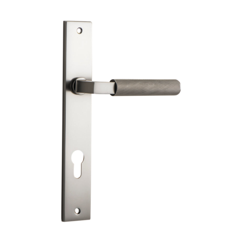 Pair of Iver Brunswick lever door handles on rectangular backplates, featuring a sleek, modern design in polished finish.