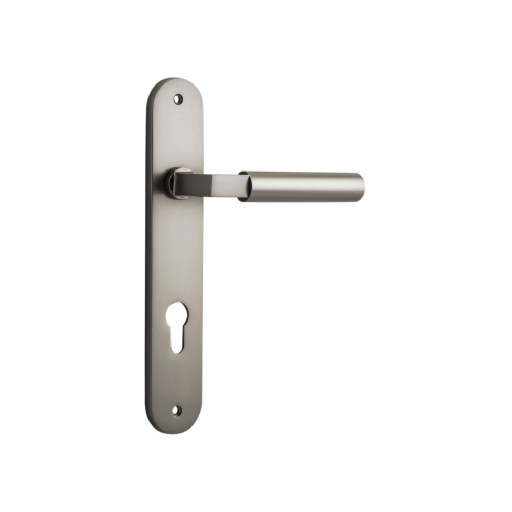 Pair of Iver Berlin lever door handles on oval backplates, featuring a sleek, modern design for interior or exterior use.