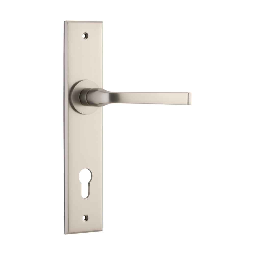 Pair of Iver Annecy lever door handles on chamfered backplates, showcasing elegant metal finish and modern design.