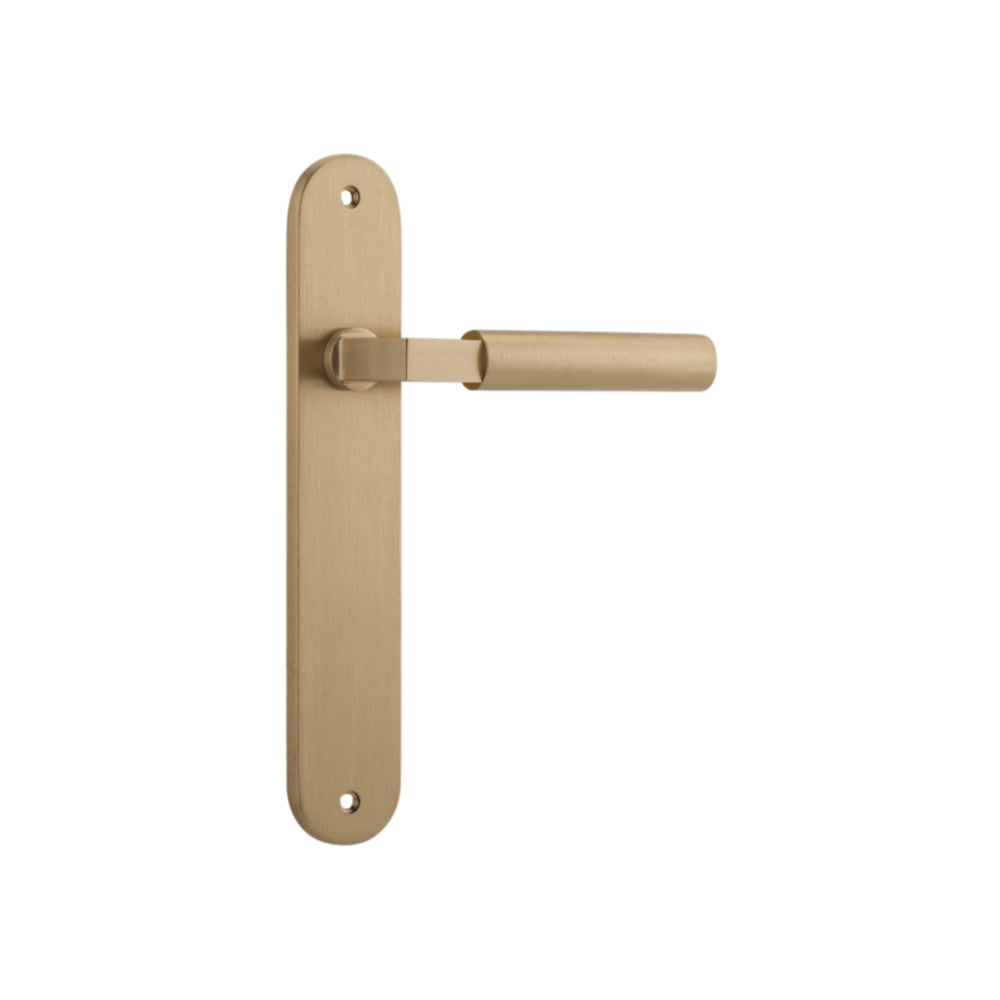 Pair of Iver Berlin lever door handles on oval backplates, featuring a sleek, modern design with a polished finish.
