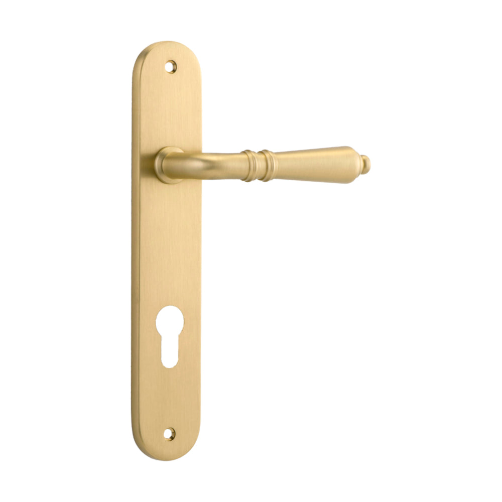 Pair of Iver Sarlat lever handles with oval backplates, featuring a sleek design and polished finish for elegant door hardware.