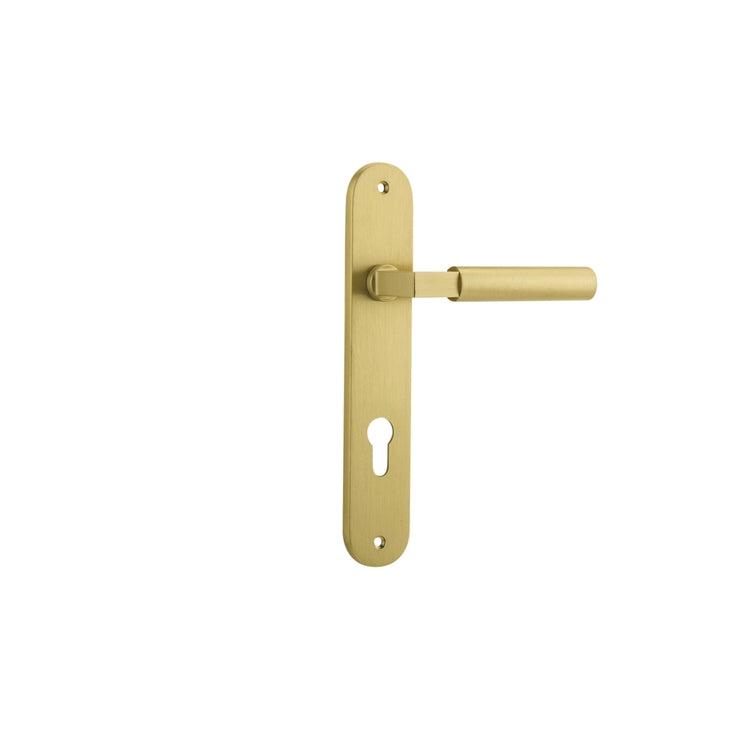 Pair of Iver Berlin lever door handles on oval backplates, showcasing polished metal finish and sleek modern design.