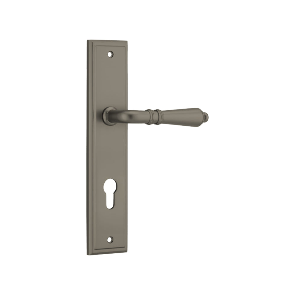 Pair of Iver Sarlat lever handles on stepped backplates, showcasing elegant hardware for doors.