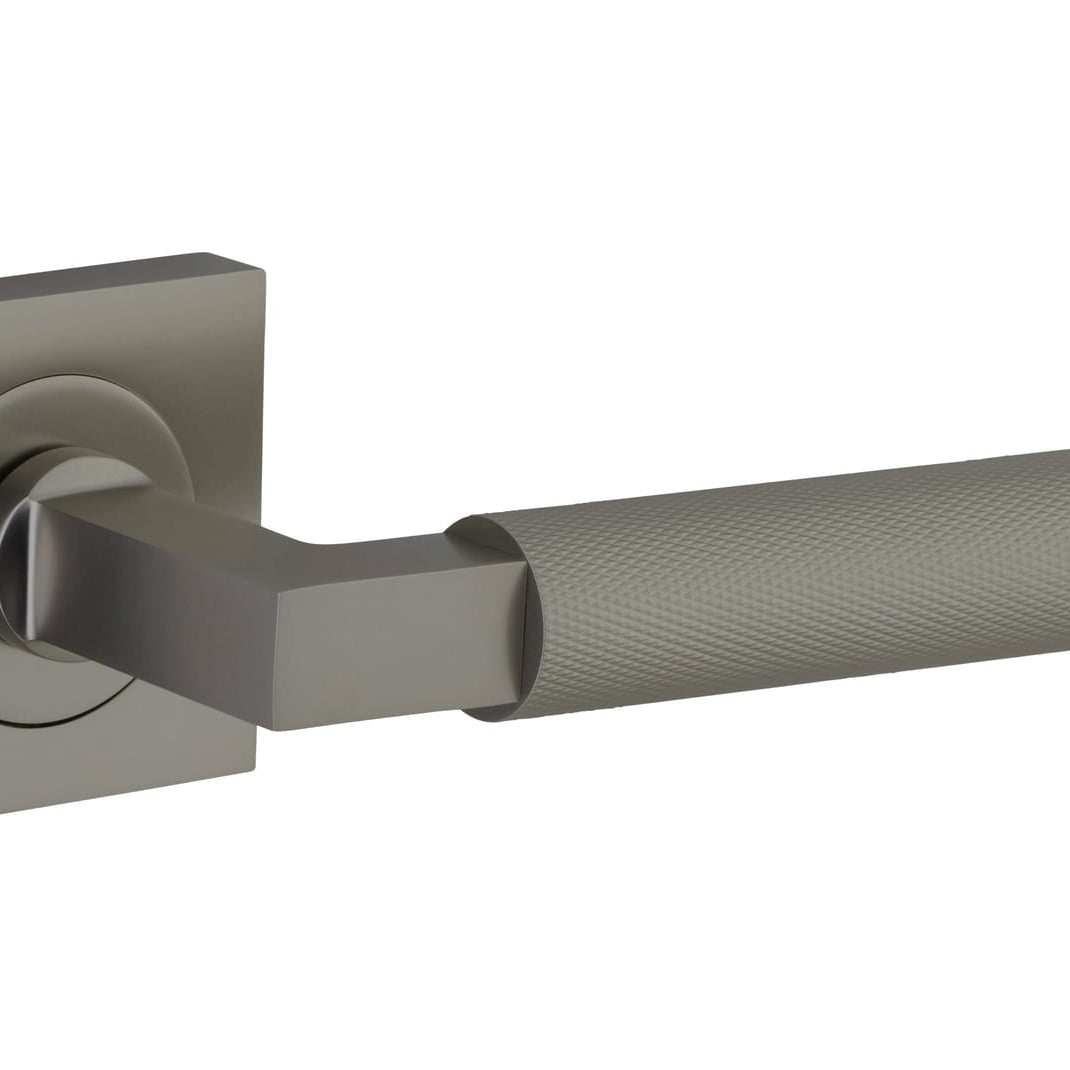 Pair of Iver Brunswick lever door handles on square rose, featuring classic brass finish and elegant design for interior doors.