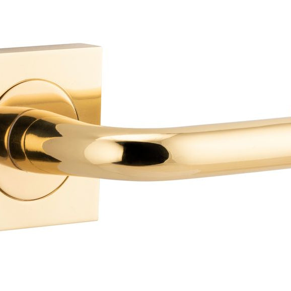 Pair of Iver Oslo Lever on Square Rose architectural hardware, featuring sleek metal handles on square rose plates.