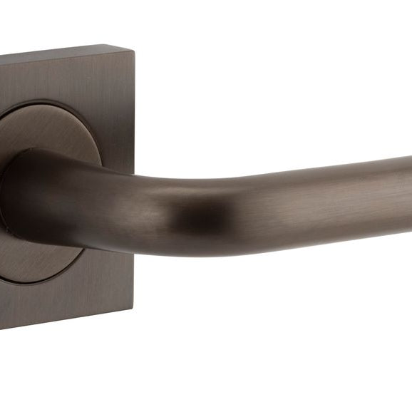 Pair of Iver Oslo Lever on Square Rose architectural hardware in a sleek, modern design, featuring polished metal finish.