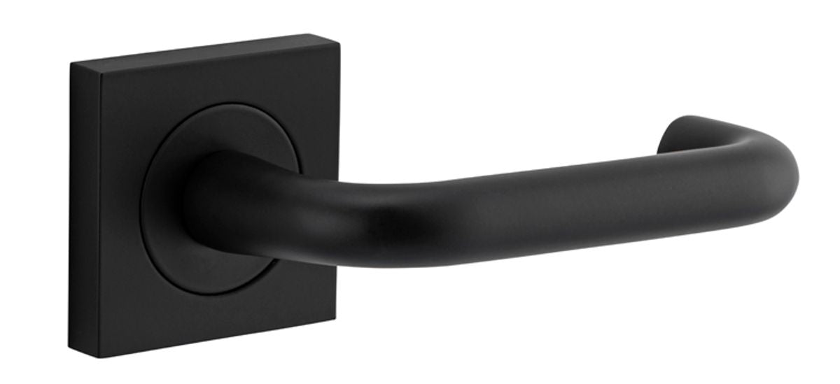 Pair of Iver Oslo Lever handles on square rose for architectural hardware, showcasing sleek metal design and modern finish.