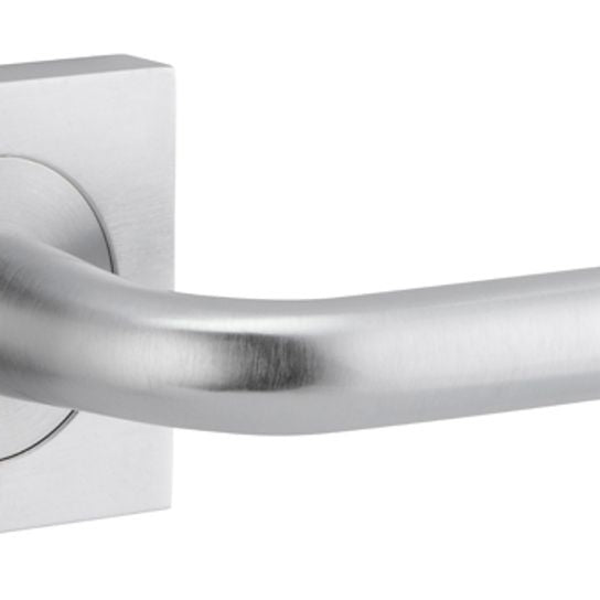 Pair of Iver Oslo Lever handles on square rose, architectural hardware in a modern design, shown in a close-up image.