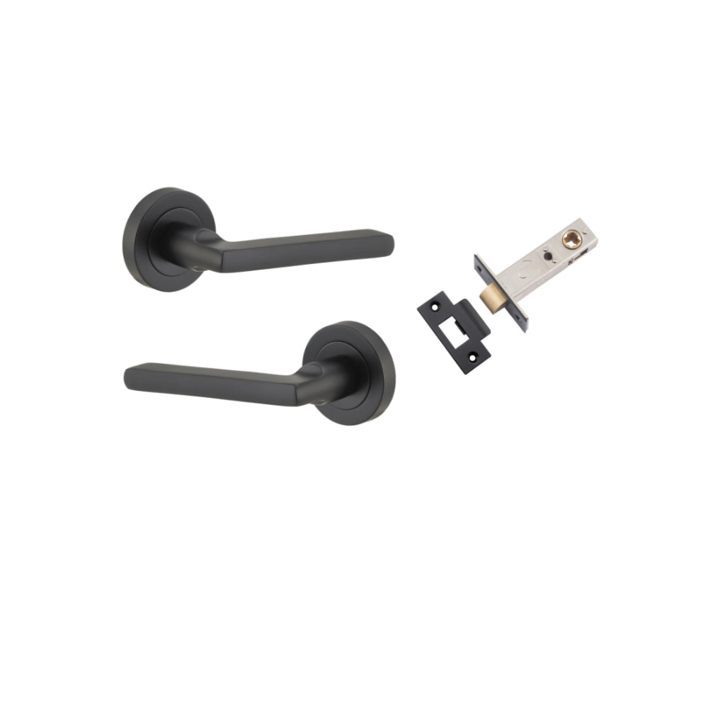 Pair of Iver Baltimore lever door handles on round rose, featuring a sleek metallic finish and modern design.