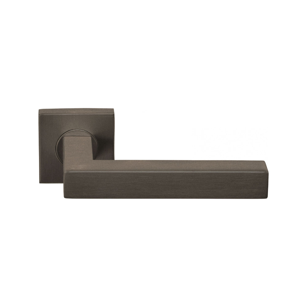 BASICS BSQ1 sprung lever handle on rose bronze in Bronze