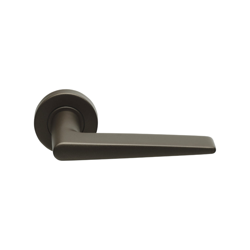 BASICS LB21H sprung lever handle on rose bronze in Bronze