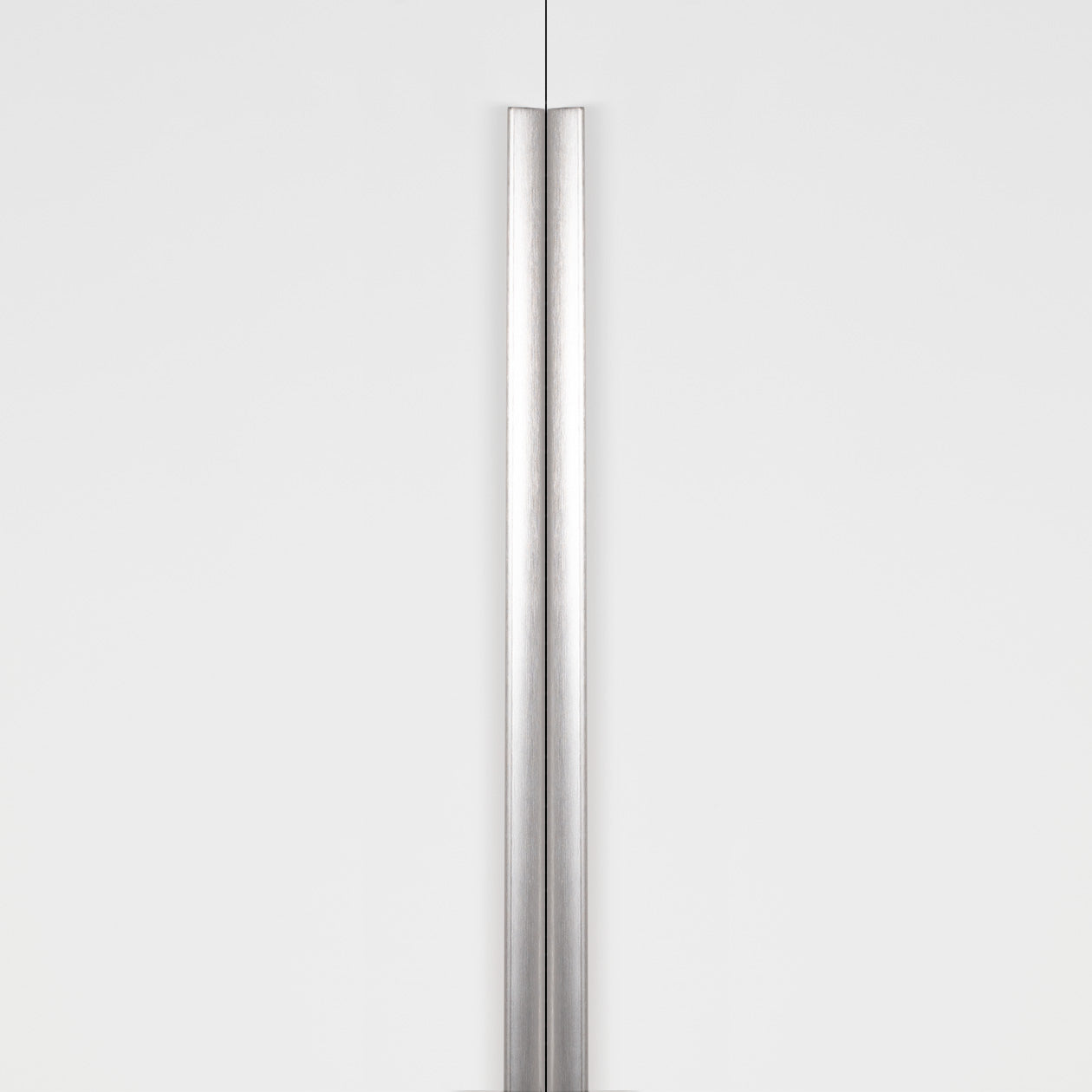 Momo ONA Long Edge Pull showing a sleek, dark bronze handle with a curved design for furniture drawers and cabinets.