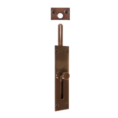 Windsor reverse barrel bolt in brass finish, shown installed on a wooden door for secure latching and safety.