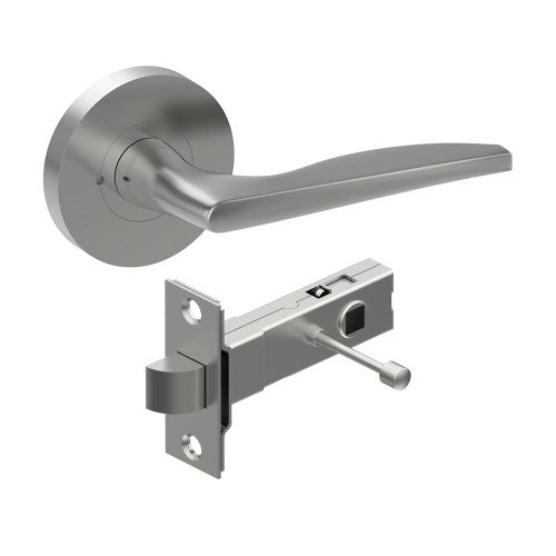 Castile door handle by Style Finish Doorware, showing a sleek, stainless steel handle with modern design on a door.
