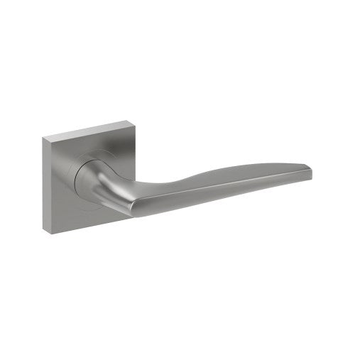 Castile door handle by Style Finish Doorware, stainless steel finish, sleek lever design mounted on door.