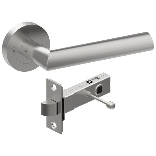 Style Finish Doorware COMO door handle in satin stainless steel, mounted on a modern door with a sleek, ergonomic design.
