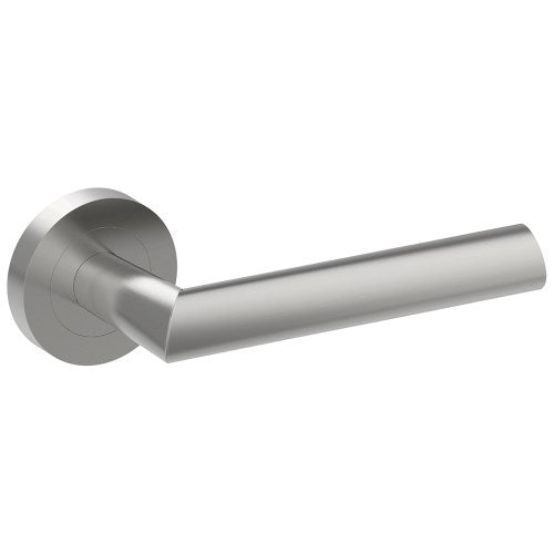 Stainless steel COMO door handle from Style Finish Doorware mounted on a door, showcasing sleek modern design.