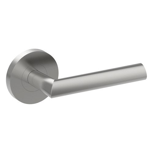 Stainless steel COMO door handle by Style Finish Doorware mounted on a door, showcasing modern design and sleek finish.