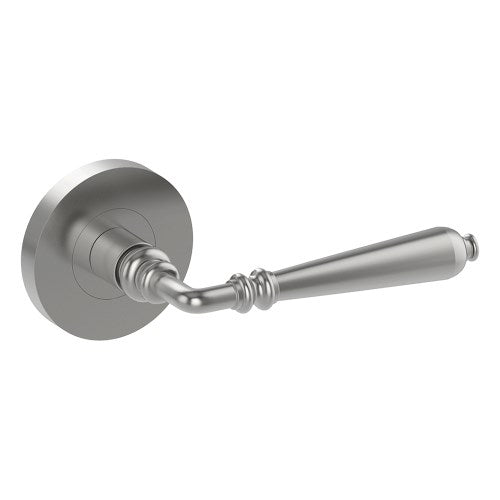 Stainless steel ELEGANTE door handle by Style Finish Doorware mounted on a door with a sleek, modern design.