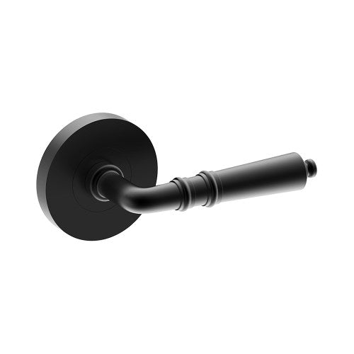 Black LATINA door handle by Style Finish Doorware mounted on a door with a sleek, modern design.
