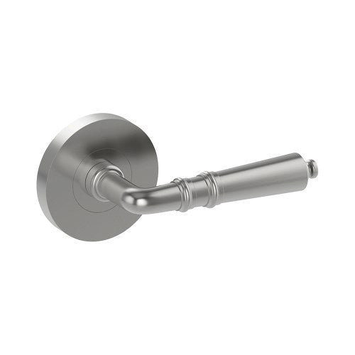 Latina door handle by Style Finish Doorware, sleek stainless steel finish, modern design, mounted on door with visible latch mechanism.