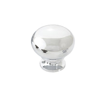Momo LUGO cabinet knob in a sleek finish, mounted on a wooden cabinet door, showcasing modern hardware design.