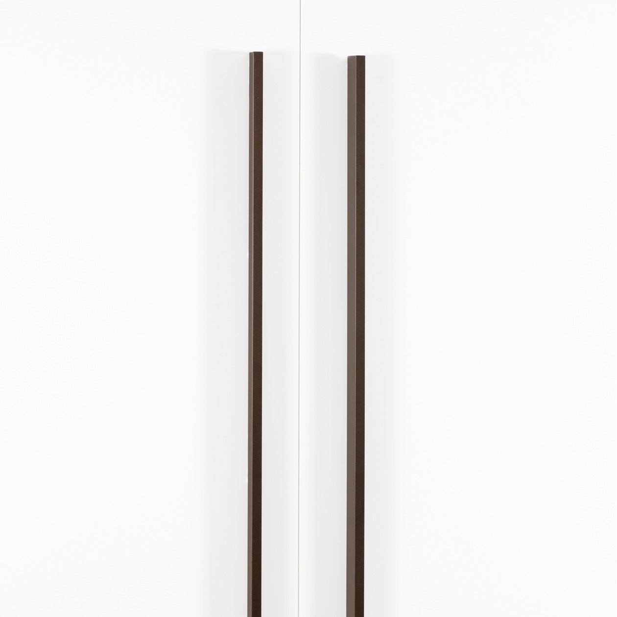 Momo ANGLE cabinet pull handle in matte bronze finish mounted on a wooden cabinet door