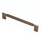 Momo ARPA D cabinet pull handle with sleek metal finish, mounted on a wooden cabinet for modern kitchen or furniture decor.