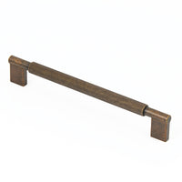 Momo ARPA D cabinet pull handle with sleek metal finish, mounted on a wooden cabinet for modern kitchen or furniture decor.