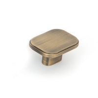 Momo Aspen cabinet knob in dark bronze finish, showing close-up of round, textured metal handle on a wooden cabinet door.