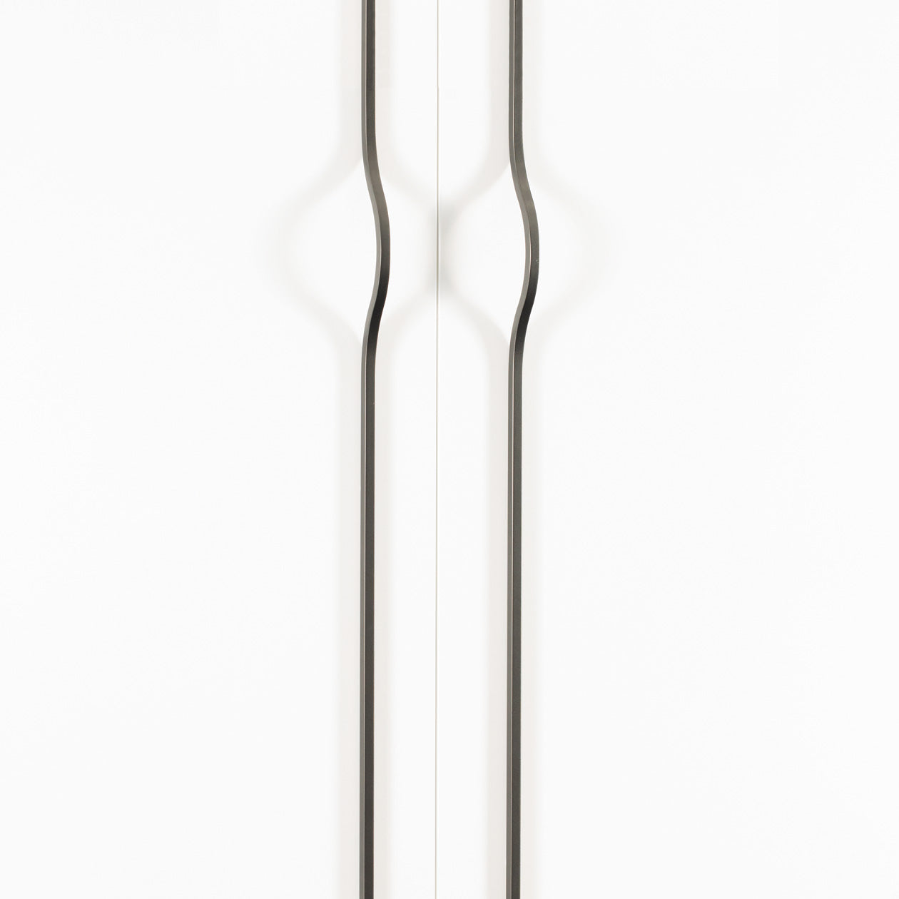 Momo BRAVE Bow Cabinet Pull Handles in matte gray finish, featuring sleek, curved design for kitchen or furniture cabinetry.
