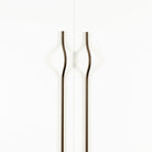 Momo BRAVE Bow off-centred cabinet pull handle in matte titanium finish, featuring a sleek curved design for modern cabinets.