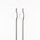 Momo BRAVE Bow off-centred cabinet pull handle in matte gray finish, featuring a sleek, curved design for modern furniture.
