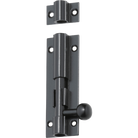 Tradco barrel bolt latch with black finish, mounted on a wooden door, for secure door fastening and added security.