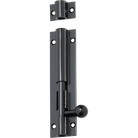 Traditional brass barrel bolt by Tradco, mounted on a wooden door for secure locking.