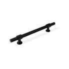 Momo BELGRAVIA knurled cabinet pull handle in matte black finish, shown on a wooden cabinet door.