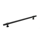 Momo Belgravia knurled appliance pull handle in matte black finish, mounted on a cabinet door, showcasing textured grip design.