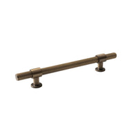 Momo BELGRAVIA lined cabinet pull handle in dark bronze finish mounted on a cabinet door.