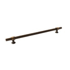Momo Belgravia lined cabinet pull handle in black finish, mounted on a cabinet door, showcasing sleek, modern design.