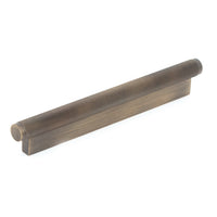 Momo Brighton cabinet pull handle in dark bronze finish with sleek, modern design mounted on a cabinet door.