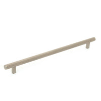 Momo Bellevue knurled appliance pull in brushed bronze finish, featuring textured metal grip for cabinet or drawer use.