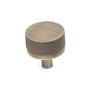 Momo Bellevue knurled cabinet knob in dark bronze finish, showcasing textured metal surface and sleek rounded design.