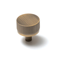 Momo Bellevue lined cabinet knob with a metallic finish and decorative design, suitable for furniture doors and drawers.