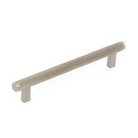 Momo Bellevue knurled cabinet pull handle in brushed bronze finish, featuring a textured grip for stylish kitchen or furniture drawers.