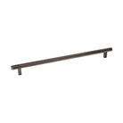 Momo Bellevue knurled cabinet pull handle in dark bronze finish mounted on a wooden cabinet door