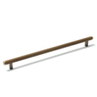 Momo Bellevue lined cabinet pull handle with brass finish, mounted on a cabinet door for a stylish, functional hardware accent.