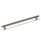 Momo Bellevue lined cabinet pull handle in dark brushed bronze finish, mounted on a cabinet door.