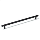 Momo BELLEVUE lined cabinet pull handle in brushed metal finish mounted on a cabinet door.
